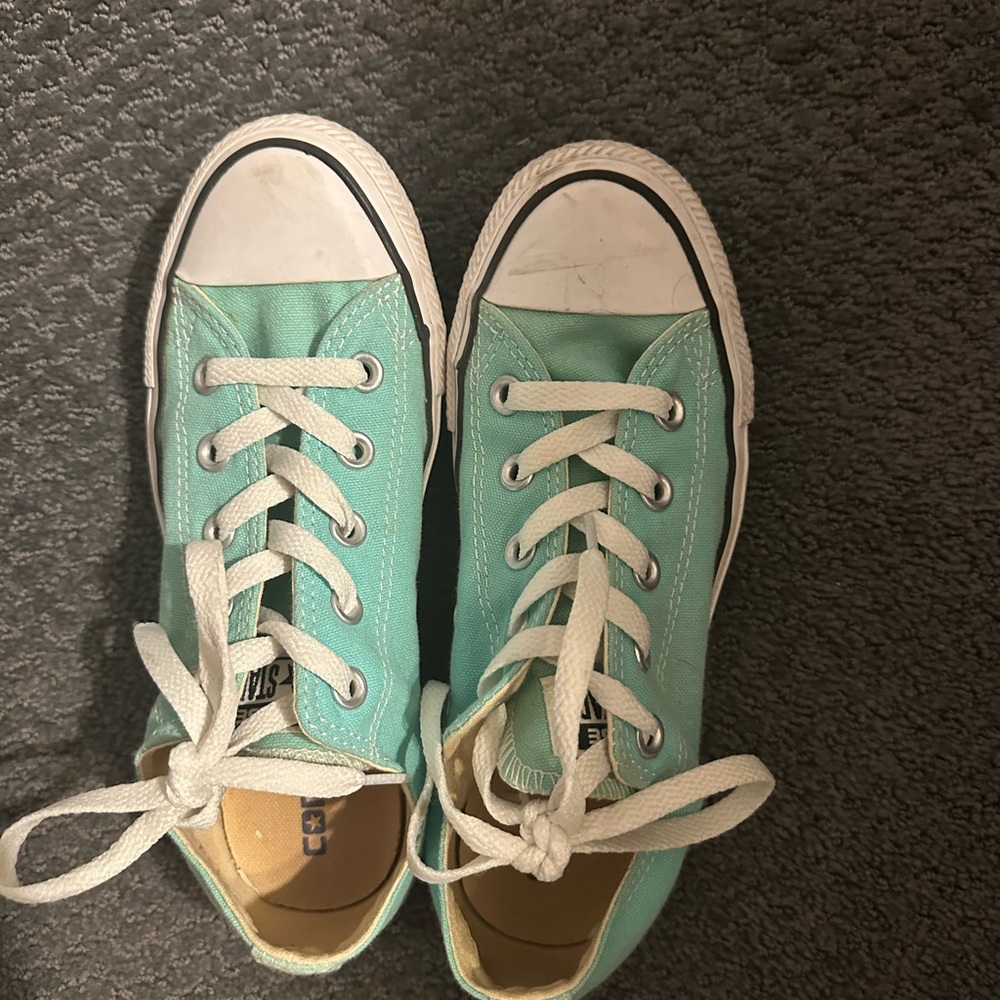 Aqua blue converse.